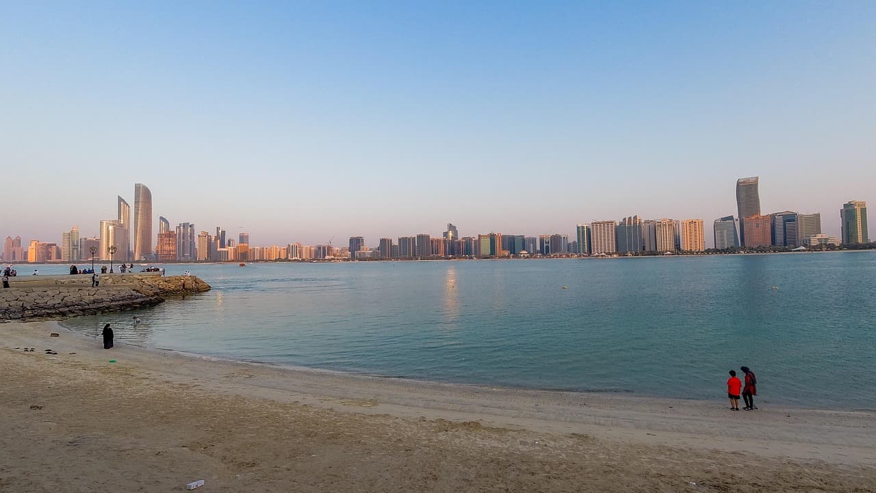 Abu Dhabi skyline across the water, illustrating the Alpaca ADGM approval for brokerage infrastructure in the UAE