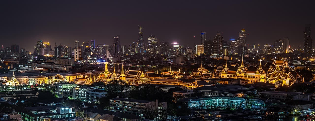 Bangkok skyline at night, home market of the DriveWealth TrueMoney investing partnership