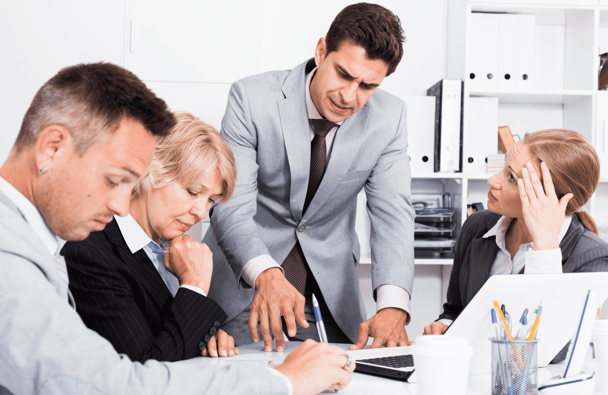Accountant reviewing a company filing on a laptop, illustrating Companies House identity verification for directors