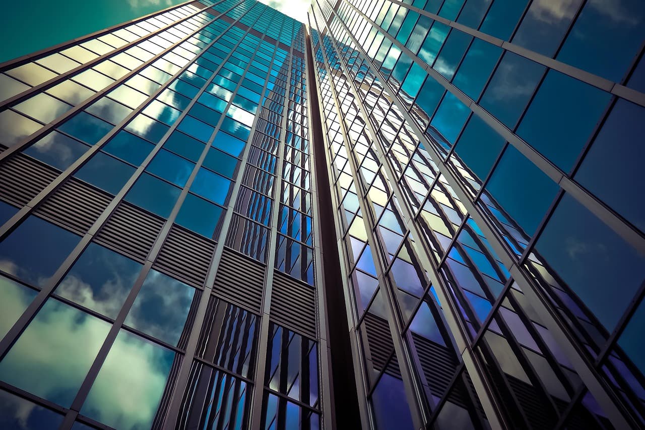 Glass office skyscraper, illustrating the Ninth Wave Agentic Control Layer for banks