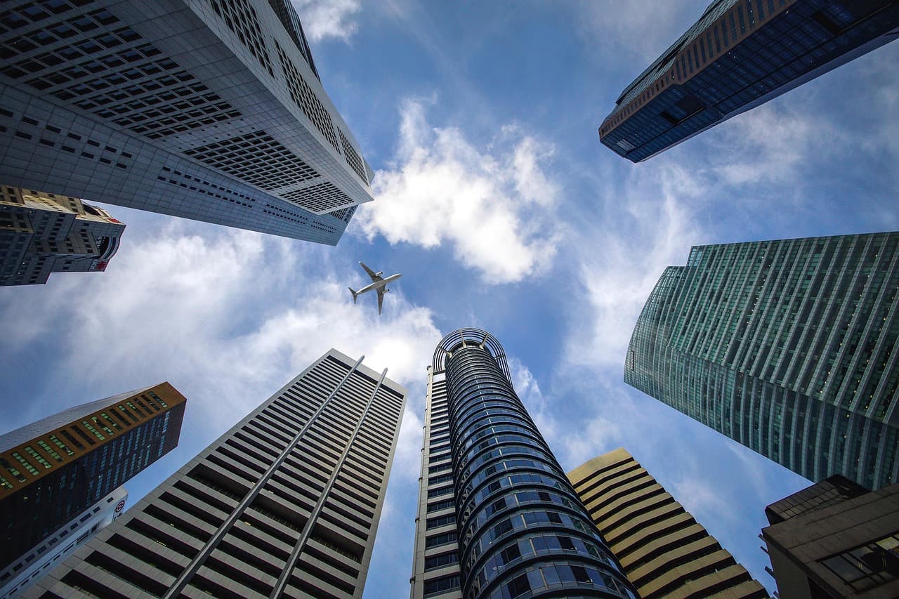Glass office towers seen from below, illustrating Ripple revenue and enterprise payments growth