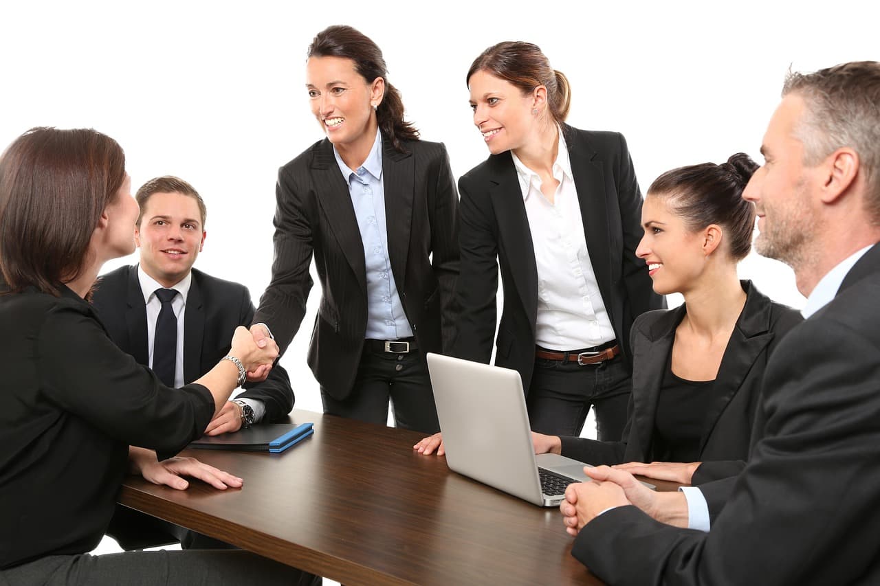 Business team at a meeting, illustrating Socure Agent Intelligence for identity checks