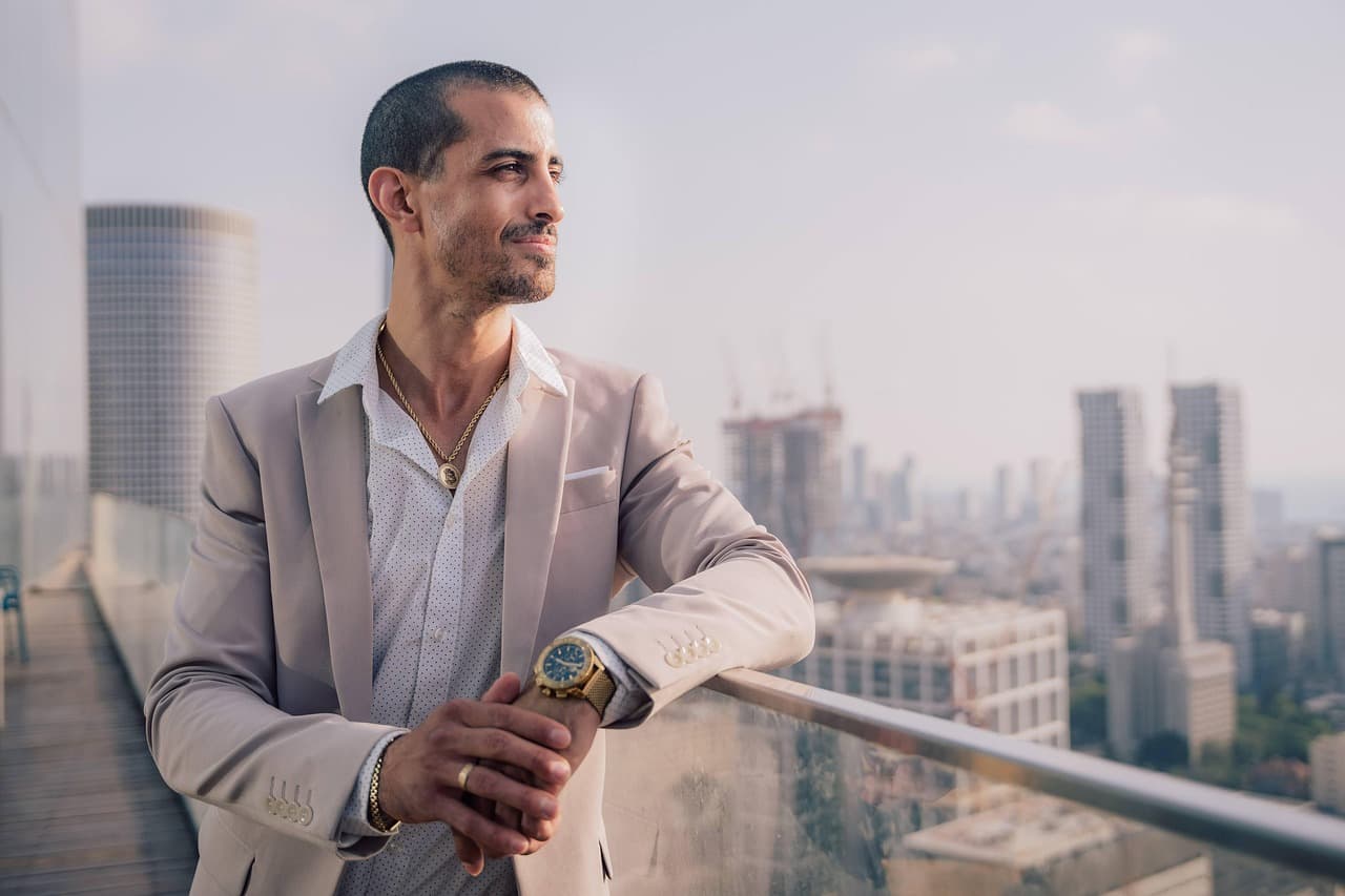 Executive in a suit by an office window, illustrating the SoFi Prudential term life partnership
