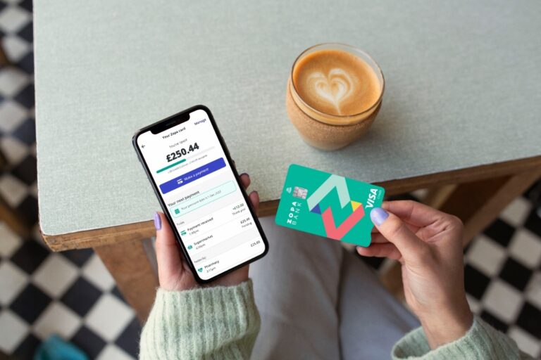 Womanholdingzopabankcredit cardandphonewithapp.jpeg