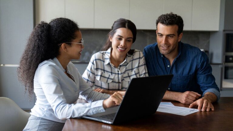 Financial advisor talks with couple new istock.jpg