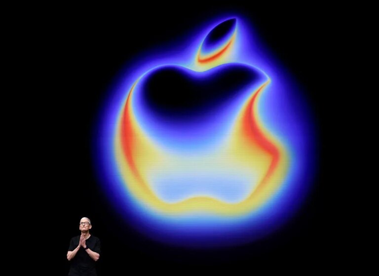 Tim cook glowing apple logo GettyImages 2234517515.jpg